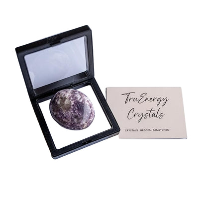Lepidolite crystal in a display case with 'True Energy Crystals' card on a white background