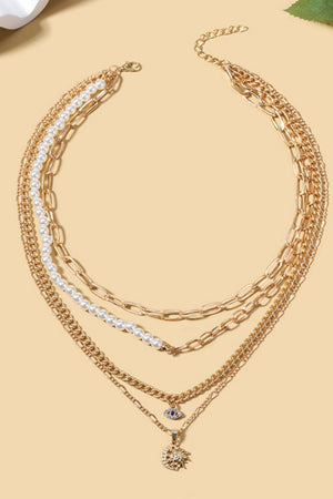 Gold Celestial Layered Necklace  with Pearl Accents, Evil Eye & Sun Moon Pendants