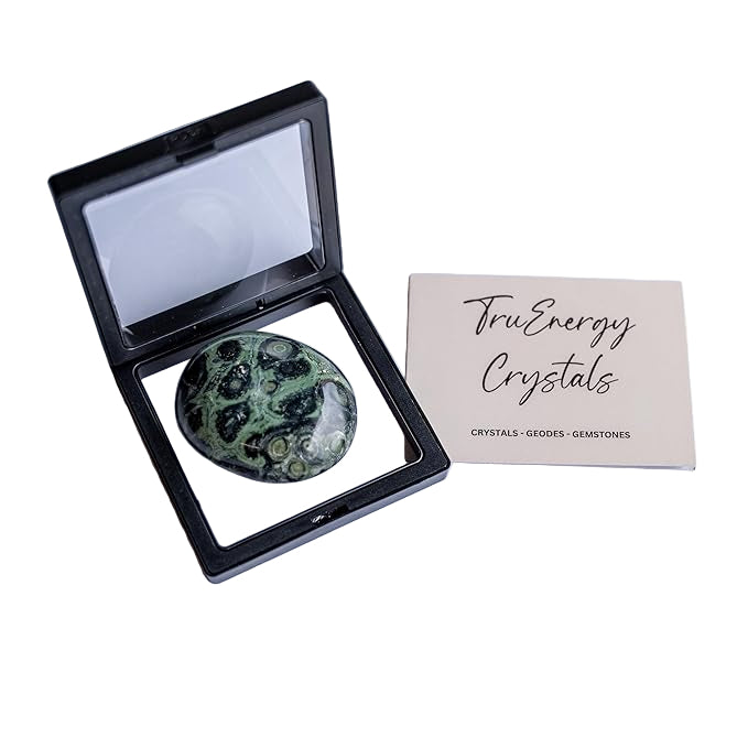 Green crystal stone in a black display case with 'Tru Energy Crystals' card on a white background