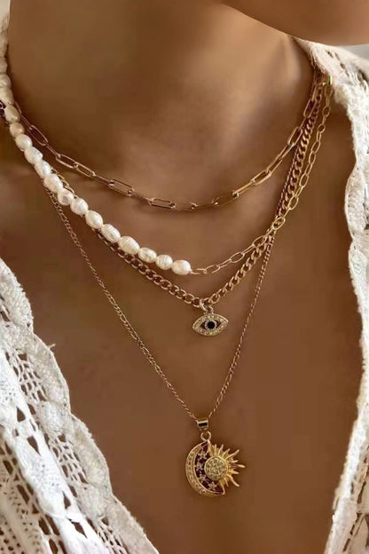 Gold Celestial Layered Necklace  with Pearl Accents, Evil Eye & Sun Moon Pendants